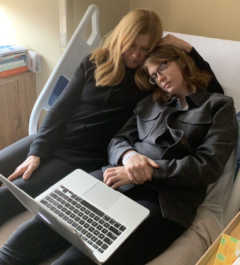 Molly Fitzgerald and her mom, Karen, watching a movie in Molly's inpatient rehab room. (Photo courtesy of Molly Fitzgerald)