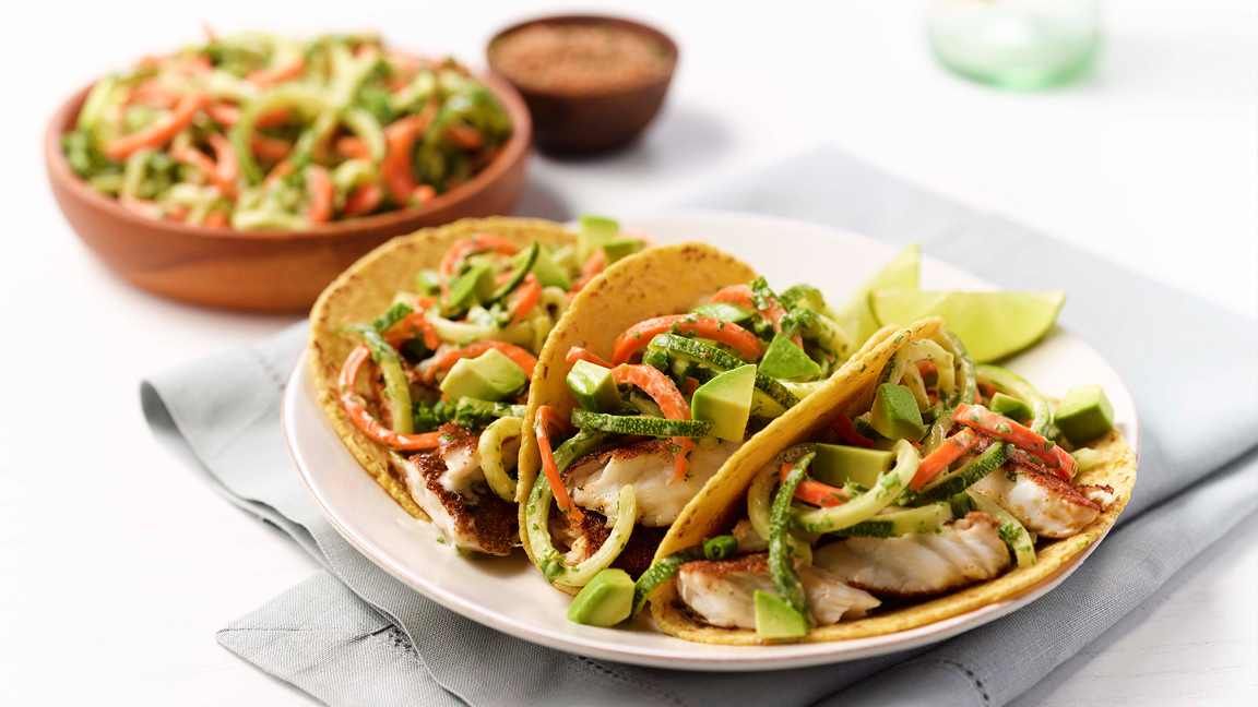 jerk tilapia fish tacos with zoodle or zucchini noodle slaw
