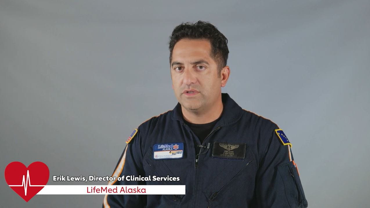 Erik Lewis, Director of Clinical Services, LifeMed Alaska in his EMS uniform against a grey background