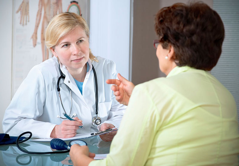Woman consulting with her female doctor