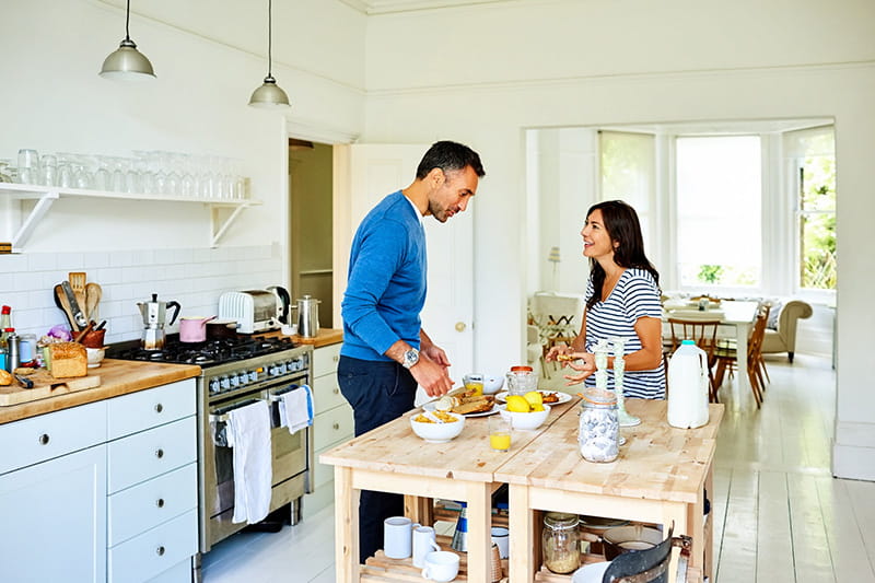 couple cooking in kitchen