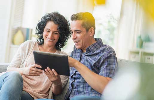 couple looking at something on tablet