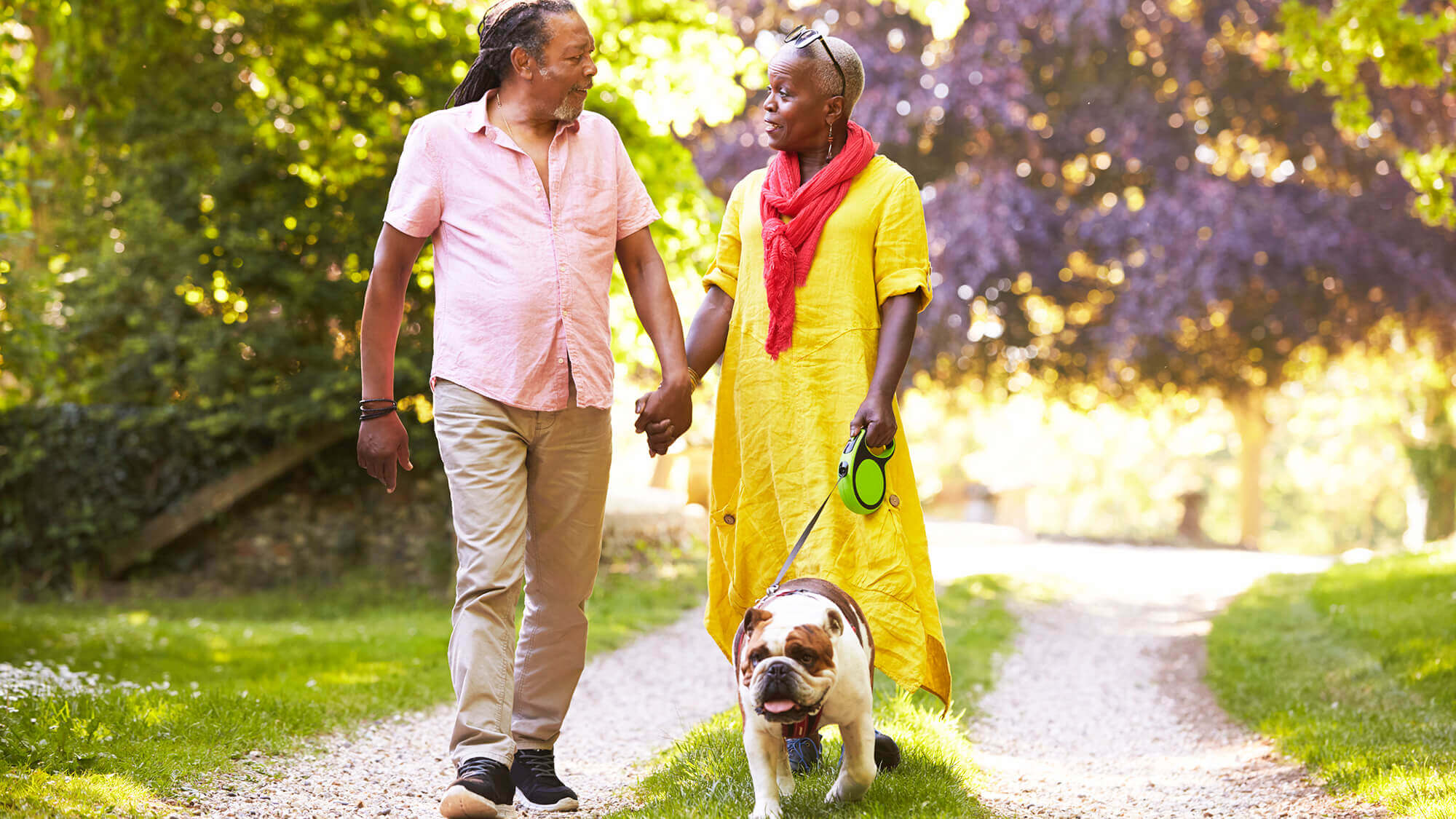 Couple walking dog