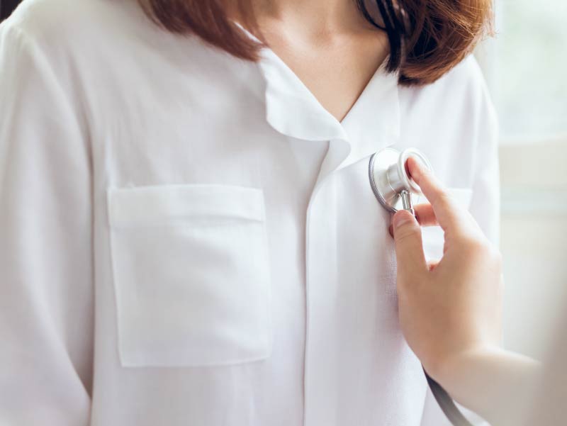 Woman with doctor's stethoscope.