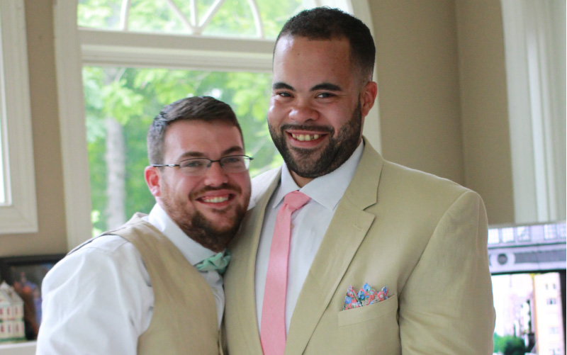 Christian England-Sullivan (left) with husband Justin on their wedding day. (Photo couresty of Caitlyn England)