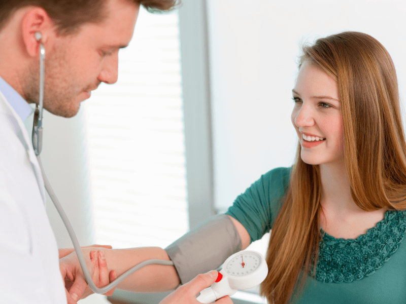 Young teen girl getting BP checked. (Henglein and Steets, Getty Images)