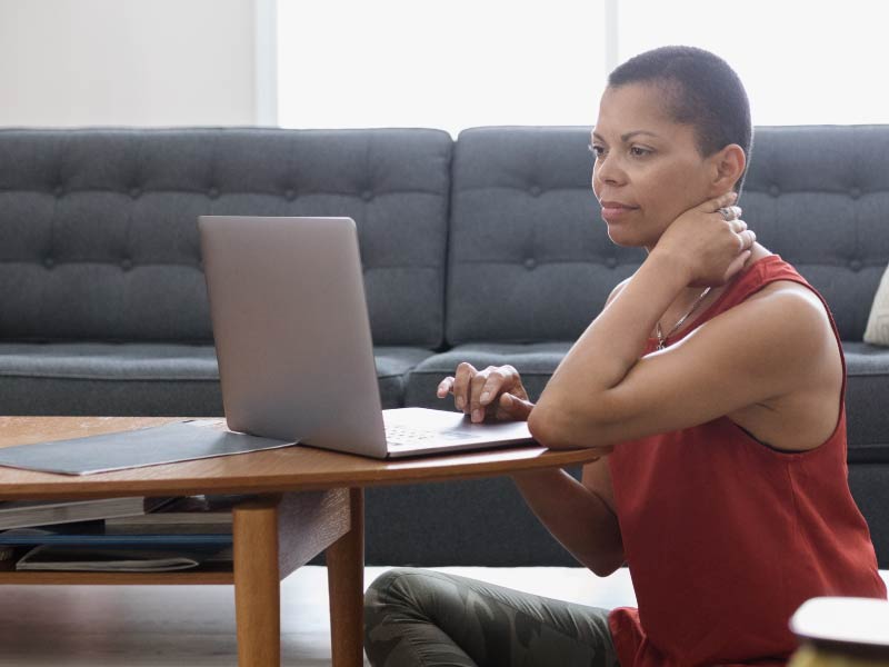 Concerned woman at computer.