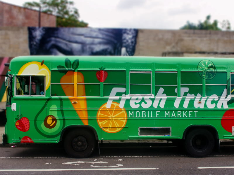 One of the converted Fresh Truck school buses that carries fresh and affordable produce. (Photo courtesy of About Fresh)