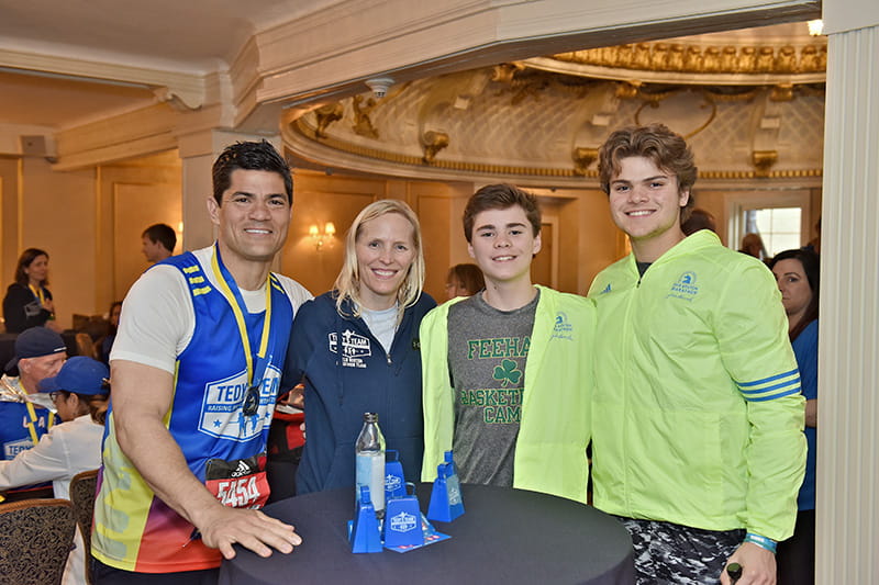 From left: Tedy Bruschi, his wife Heidi, and sons Dante and Rex. (Photo courtesy of Stacy Smith Studios)