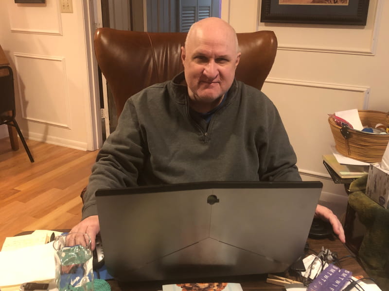 Heart disease survivor Dr. Tim Martindale in the living room chair where he spent much of his time recovering from COVID-19. (Photo courtesy of Dr. Tim Martindale)
