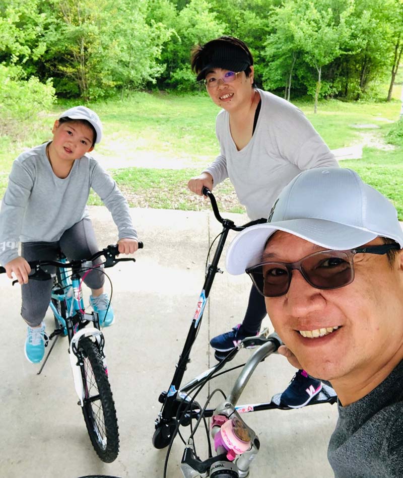Clockwise from left: Cheyenne Kuo and her parents, Francis Huang and James Kuo, take part in an at-home physical education class. Cheyenne spent her fifth grade year learning remotely but will resume in-person classes in August. (Photo courtesy of the Kuo family) 