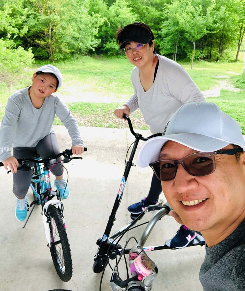 Clockwise from left: Cheyenne Kuo and her parents, Francis Huang and James Kuo, take part in an at-home physical education class. Cheyenne spent her fifth grade year learning remotely but will resume in-person classes in August. (Photo courtesy of the Kuo family)