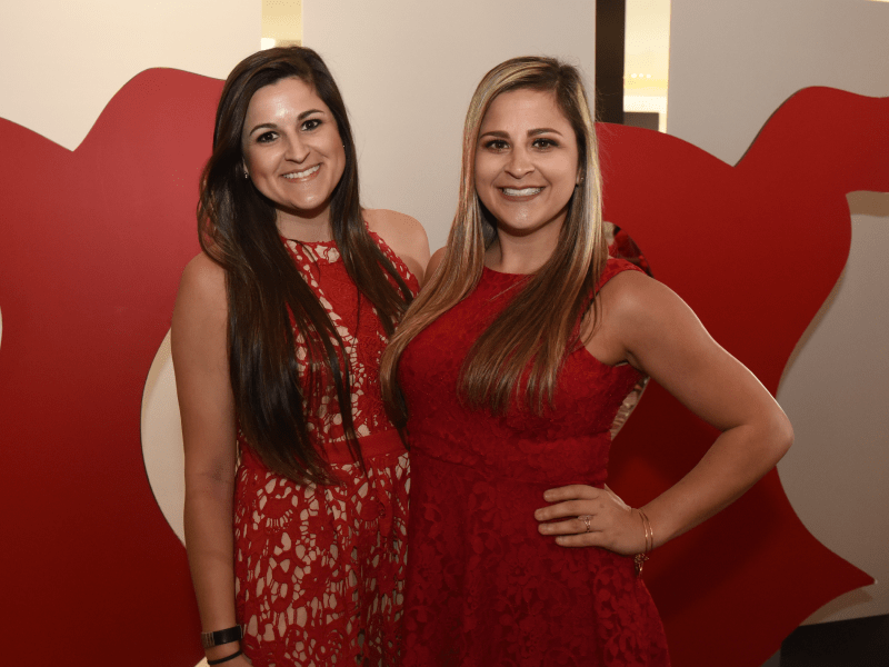 Amanda Tinney (left) and sister, Kelli Tinney, at the 2018 Go Red For Women luncheon in New Orleans.  (Photo courtesy of Jeff Strout Photography)