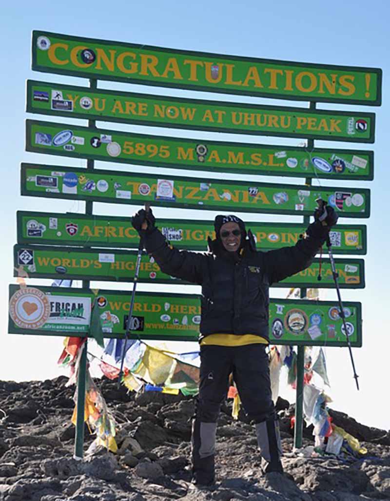 Dr. Akil Taherbhai at the peak of Mount Kilimanjaro. (Photo courtesy of Dr. Akil Taherbhai)