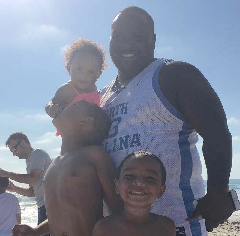Kristen’s husband Dominque poses with daughter Sariah and sons Braxton (middle) and Avery (forefront) at Mission Beach in San Diego. (Photo courtesy of Kristen Criss)