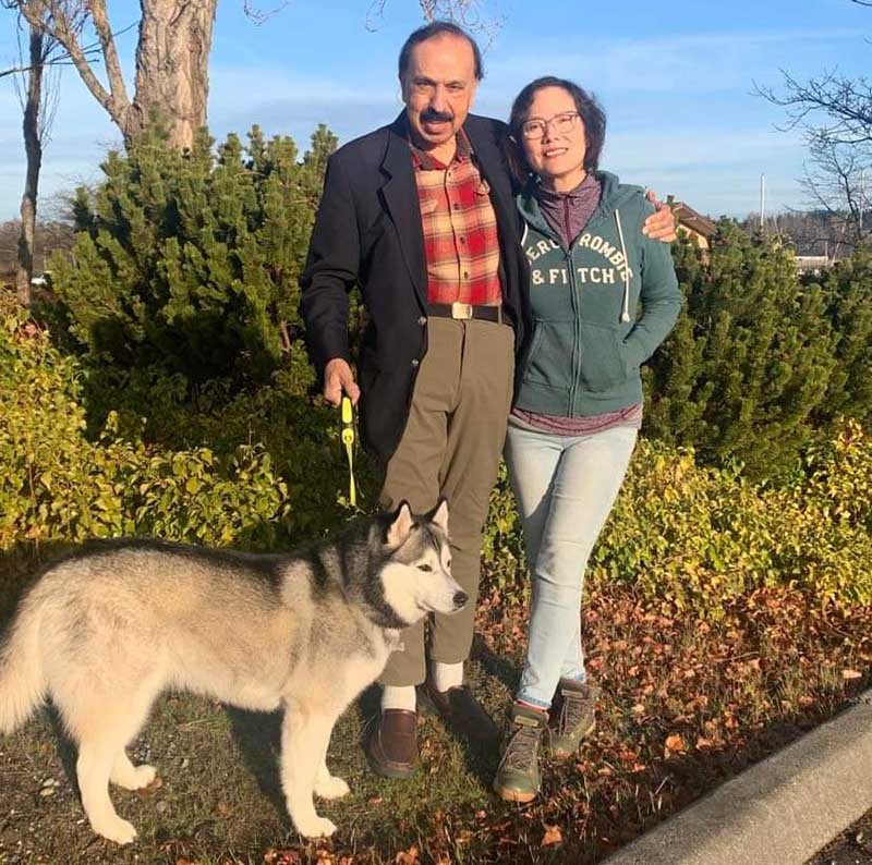 Romi Singh (left) with his wife, Xiaobo, and their dog, Taitai. (Photo courtesty of Romi Singh)