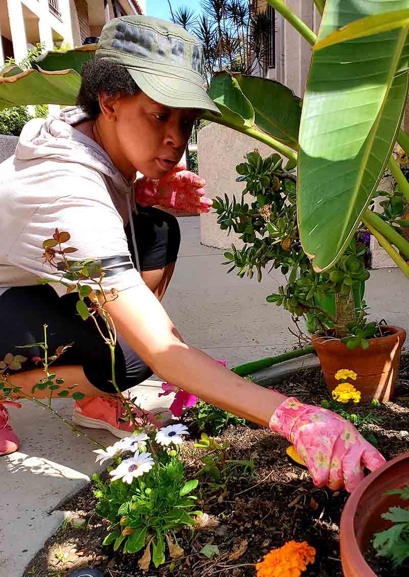 Sindi Mafu tends to her garden as she continues to recover from her SCAD experience. (Photo courtesy of Ndumiso Mafu)