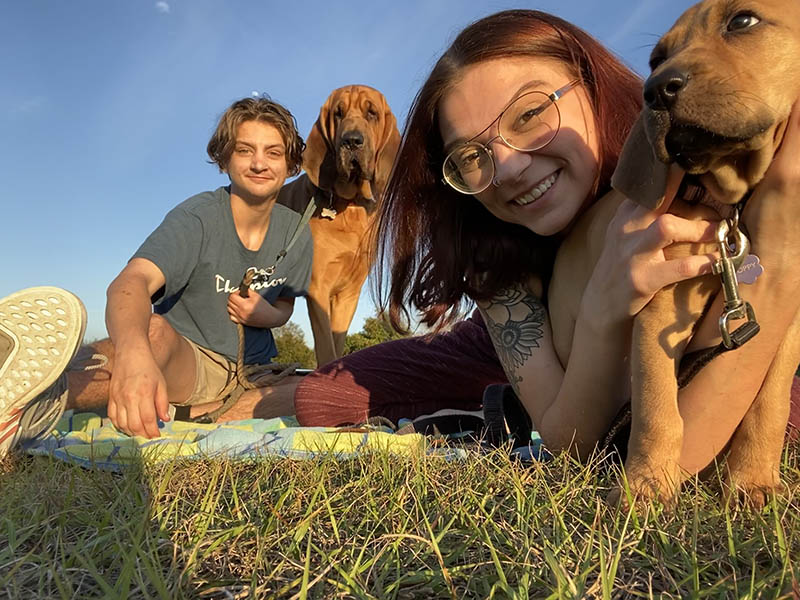 Maddox Jones enjoys a hike with his girlfriend, Pam, and their bloodhounds, George and Poppy. (Photo courtesy of Maddox Jones)