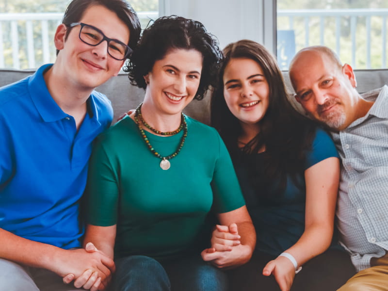 Stroke survivor Allison Zmuda with her family. From left: Cuda, Zoe, Zmuda and Tom. (Photo courtesy of Annie Sykes)