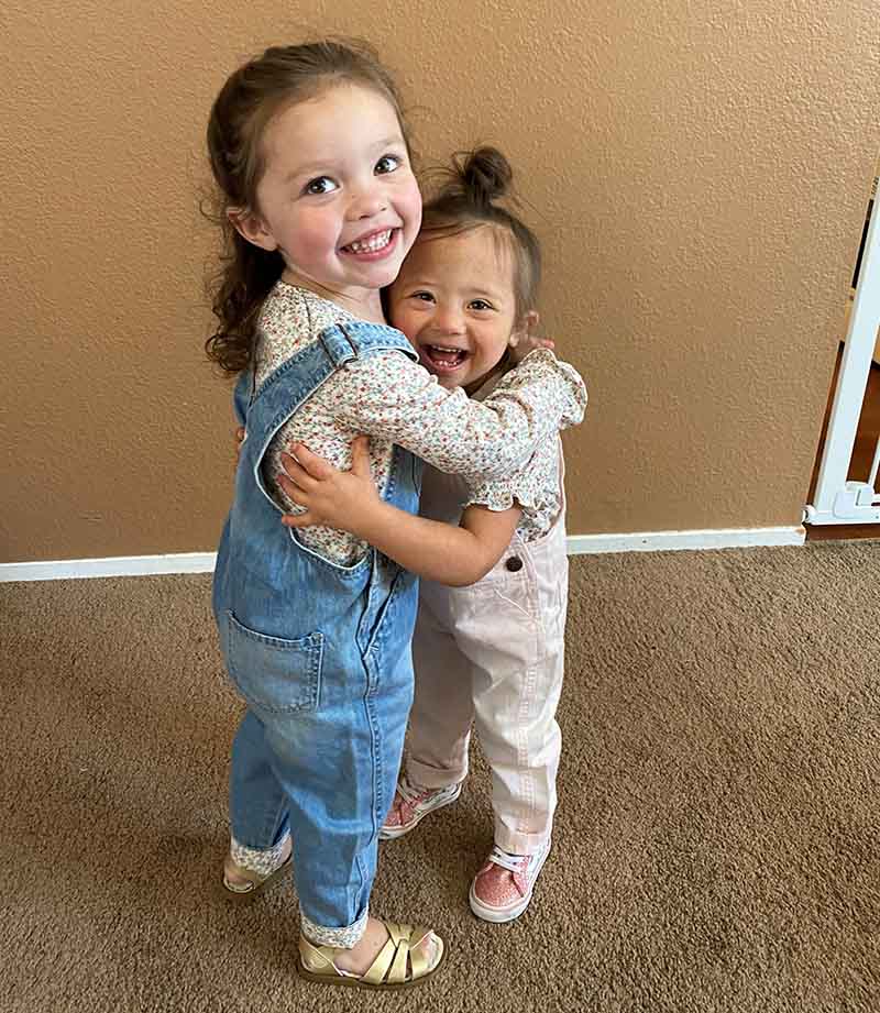 Ariel Hernandez (right) hugs her twin sister, Katalina. (Photo courtesy of Kristal Hernandez)