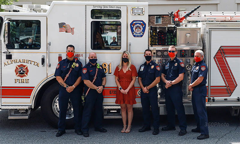 Alpharetta firefighters with Nicole Tetreault in 2022, from left: Kyle Cocita, Mark Maikoski, Nicole, Ryan Rusterburg, Shawn Blood and Craig Schmidt. (Photo courtesy of the Tetreault family)