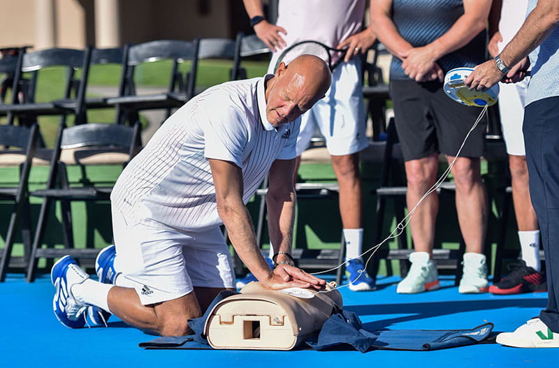 Murphy Jensen demonstrating Hands-Only CPR at the 2022 Gootter Foundation tennis tournament. (Photo courtesy Matt Fitzgerald/Tennis Channel)