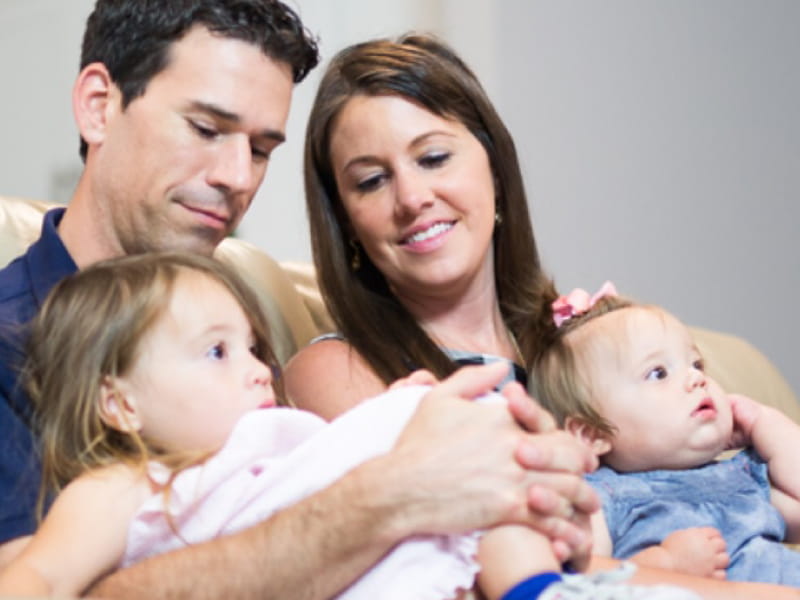 Stroke survivor Amanda Moreland with her husband, Tony, and their two daughters. (Photo courtesy of Brooks Rehabilitation)