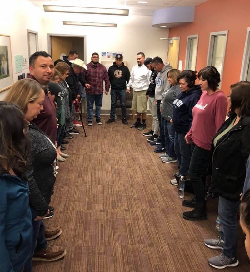 Friends and family of Eddie Garcia pray and tell stories in the ICU waiting room. (Photo courtesy of Eddie Garcia)