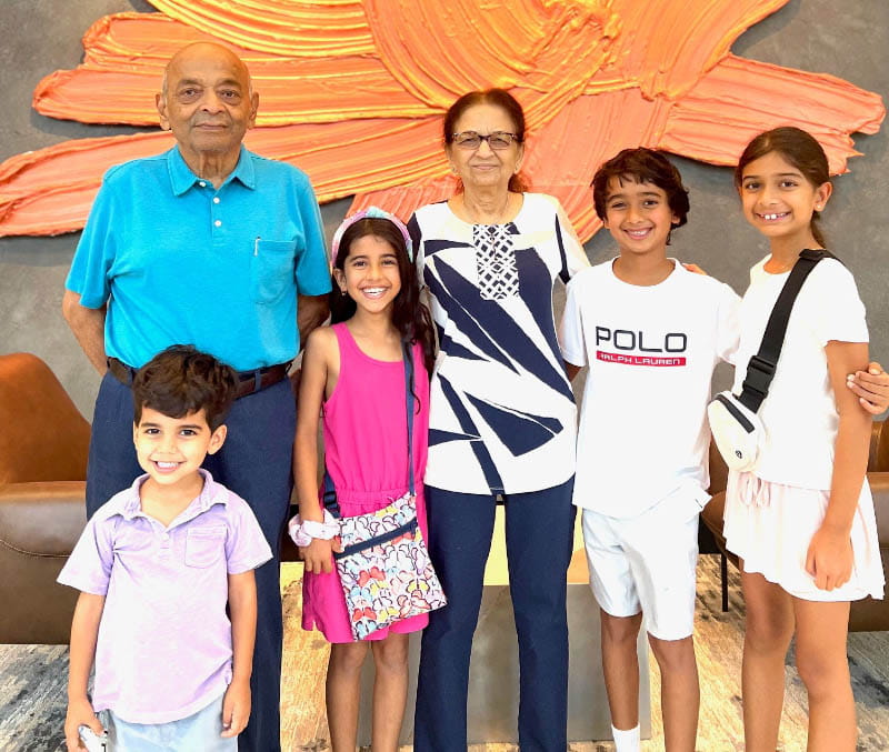 Rekha Desai with her husband, Rohit (far left) and grandchildren, from left: Kaveh, Kaiya, Armaan and Anya. (Photo courtesy of Dhaval Desai)