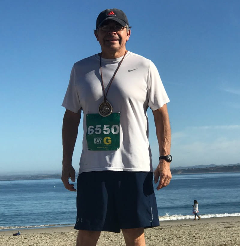 Greg Gonzales with his finisher’s medal following a previous Monterey Bay Half Marathon. (Photo courtesy of Greg Gonzales)