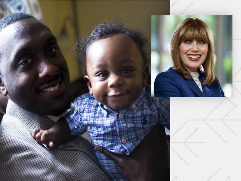 Charles Daniels, Jr., founder of Fathers UpLift, holding son Clayton. (Photo by Ann Wang)