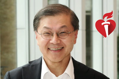 a portrait of David Ho, MD, with a neutral abstract background