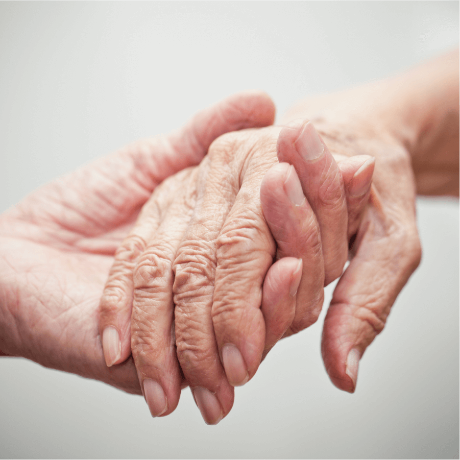 Elderly hands holding each other