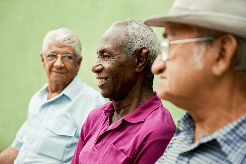 diverse group of older men talking