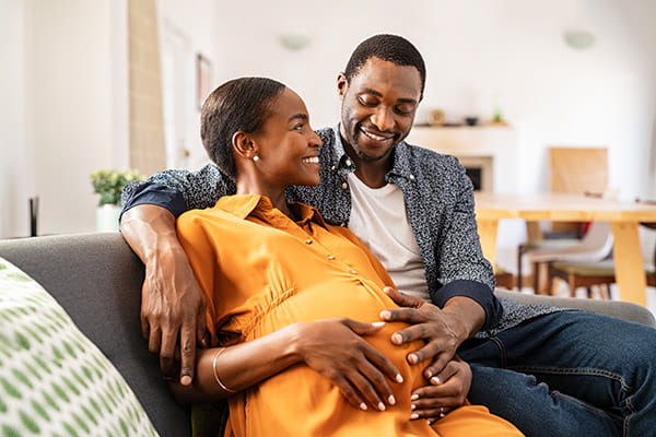 Happy Black couple expecting a baby