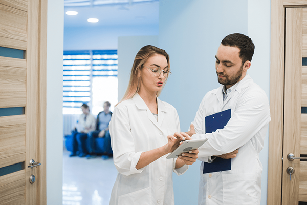 Medical staff having discussion in hallway