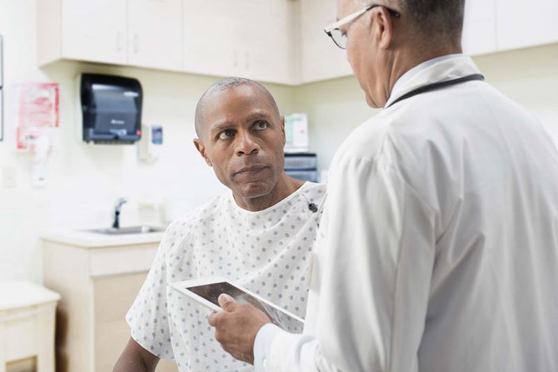 Man talking to doctor