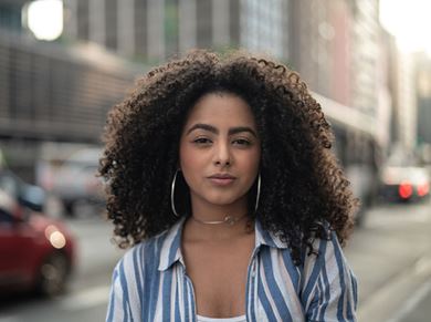 woman standing on a street corner