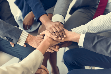 business team stack hands to demonstrate support