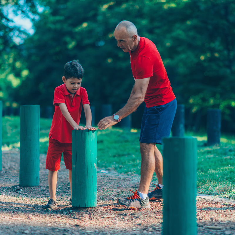 Grandfather and Grandson exercising in the park
