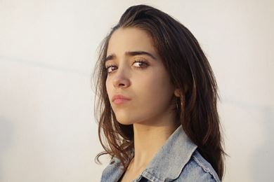 young woman looking directly into the camera