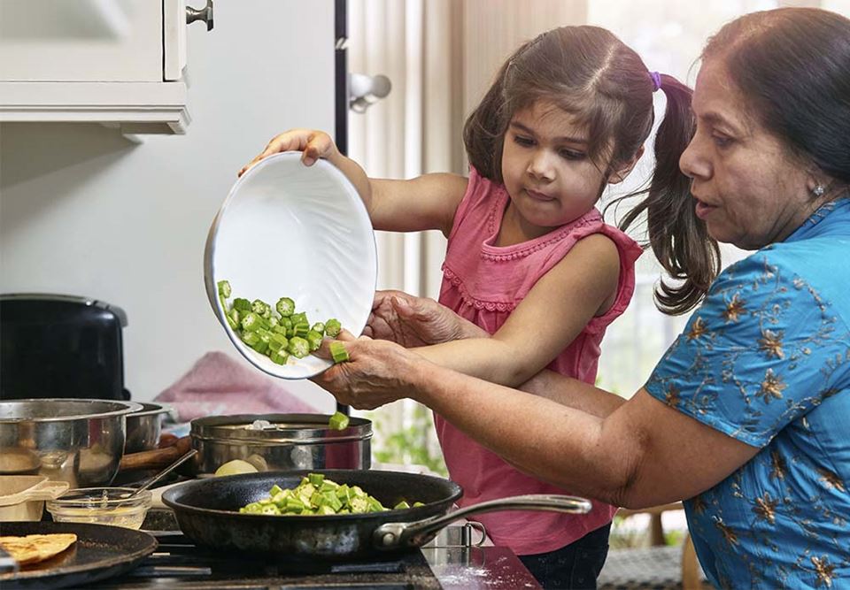 Grandmother and grandchild cooking