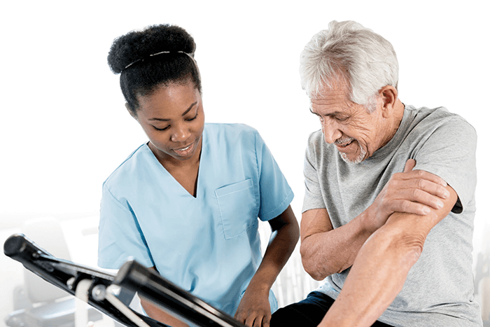 Rehab doctor helping older male patient