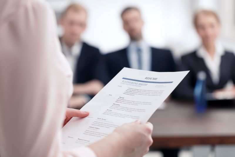 Woman holding a resume at a job interview