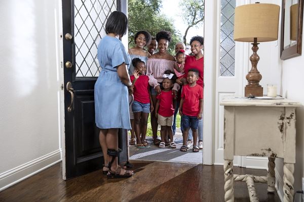 family visiting at door