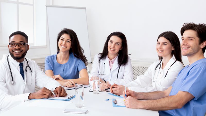 group of medical professionals sitting around a table