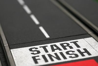 A running track with "start" and "finish" painted at the start line