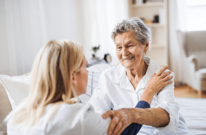 woman in hospital room with a female visitor