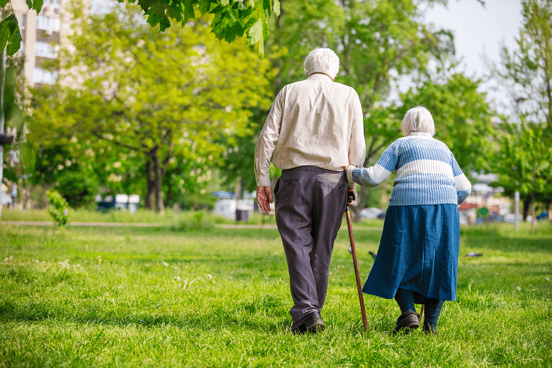 Older Couple Walking Outside