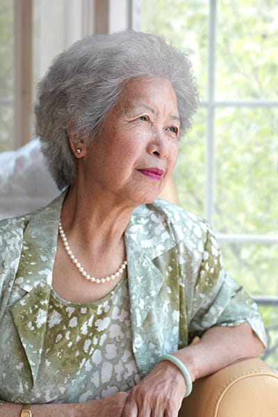 Chinese woman sitting post stroke